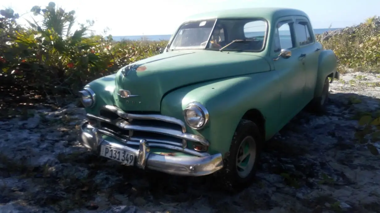 Vintage car on the way from Caleta Buena to Playa Giron, Bay of Pigs, Cuba