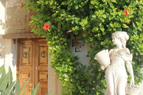House in Luqa decorated with straw cover, door handles, flowers, ceramic decorations and s statue