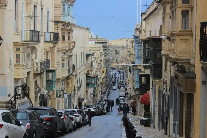 Honey colored buildings and traditional balconies in Valletta, Malta