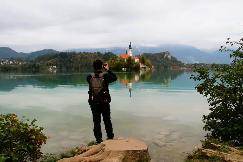 Taking photos of the church in the middle of the lake